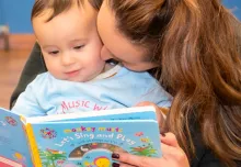 mum and baby reading a Monkey Music children's book