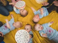 A group of happy babies at a Monkey Music class